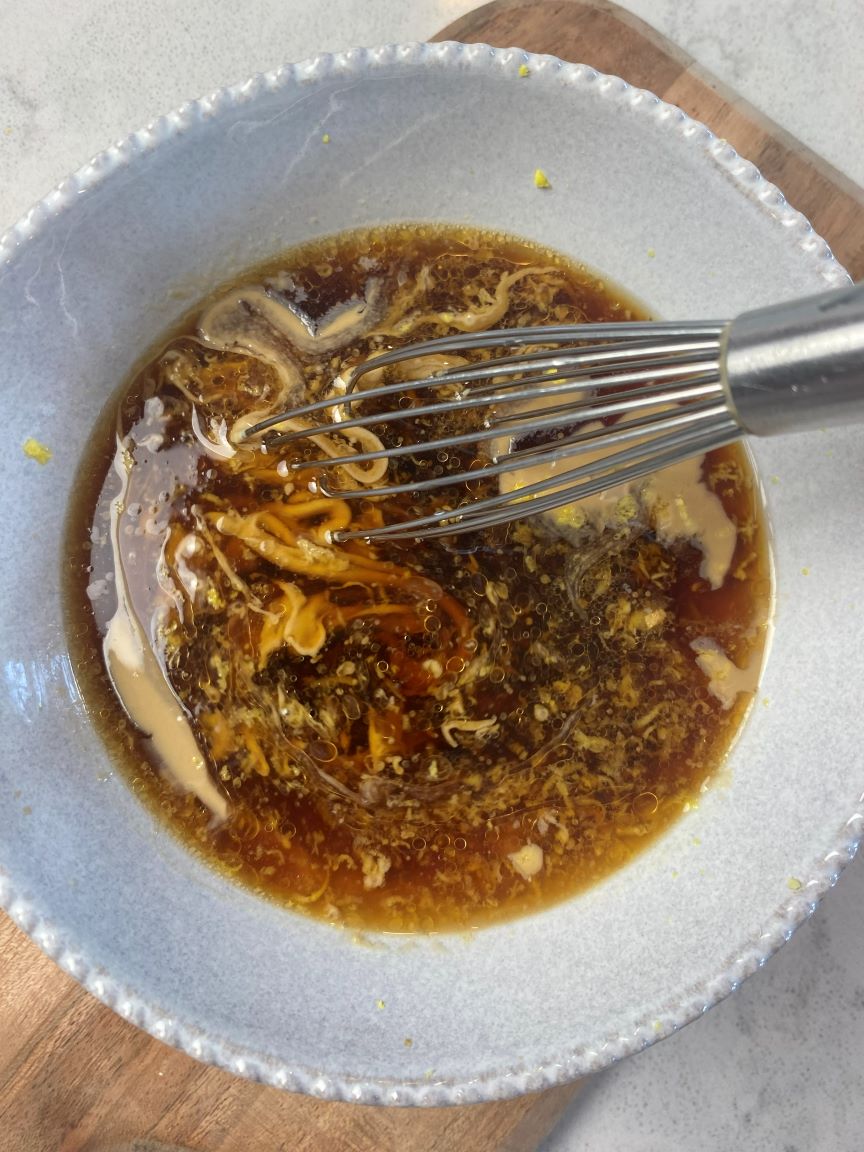 sesame ginger sauce in gray bowl